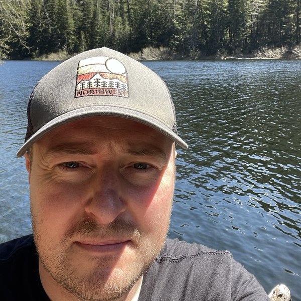 Kevin outdoors by a lake